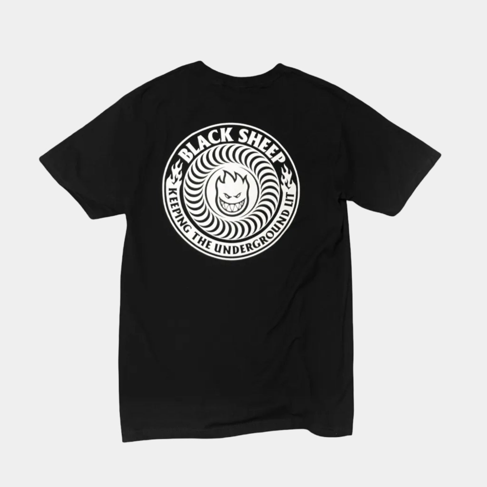 A black short-sleeve t-shirt with a circular white graphic on the chest featuring the text 'BLACK SHEEP' and 'LETTING THE UNDERGONE IN' around a stylized face, displayed on a solid white background.