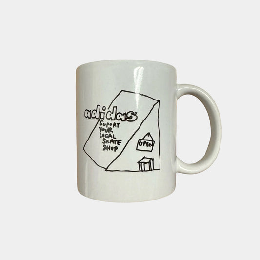 White mug with black graphic and text on a white background